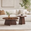Retro-style Nesting Coffee Table Set. Available In Walnut Or Natural Wood Finishes. Round Nesting Side Tables With Crisscross Legs. Ideal For Living Rooms And Dining Rooms.